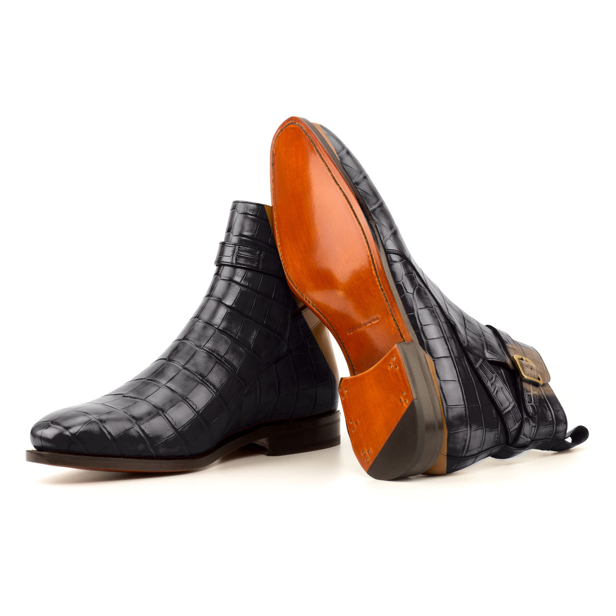 Bottines Jodhpur en cuir croco noir : une bottine couchée montre la semelle