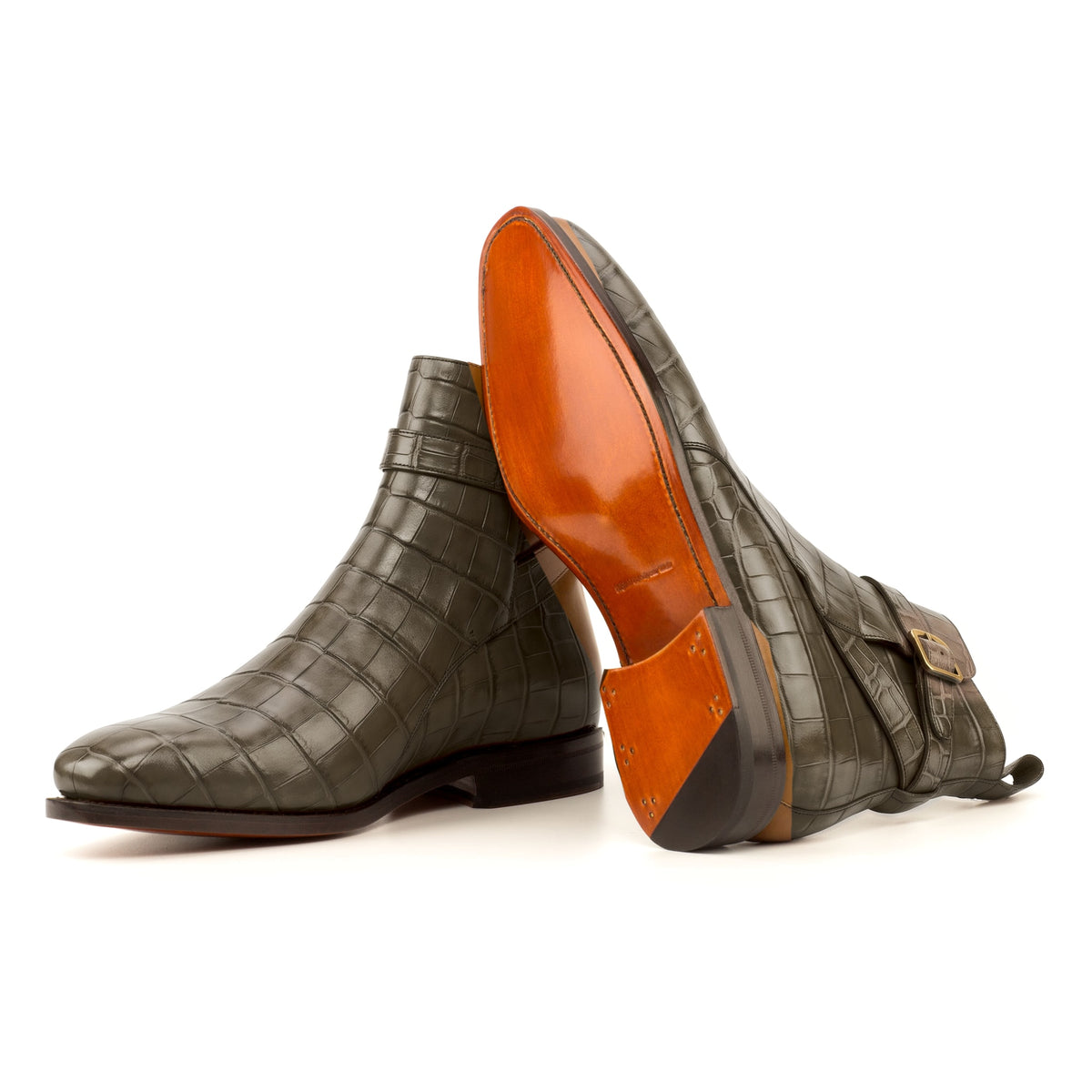 Bottines Jodhpur en cuir croco vert olive : une bottine couchée montre la semelle