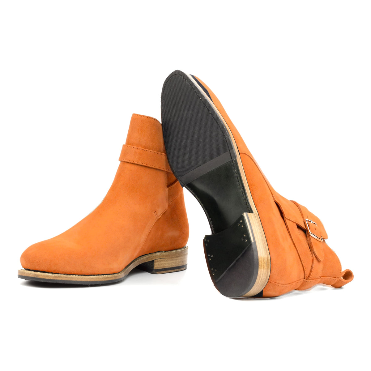 Bottines Jodhpur en daim de chevreau orange : une bottine couchée montre la semelle