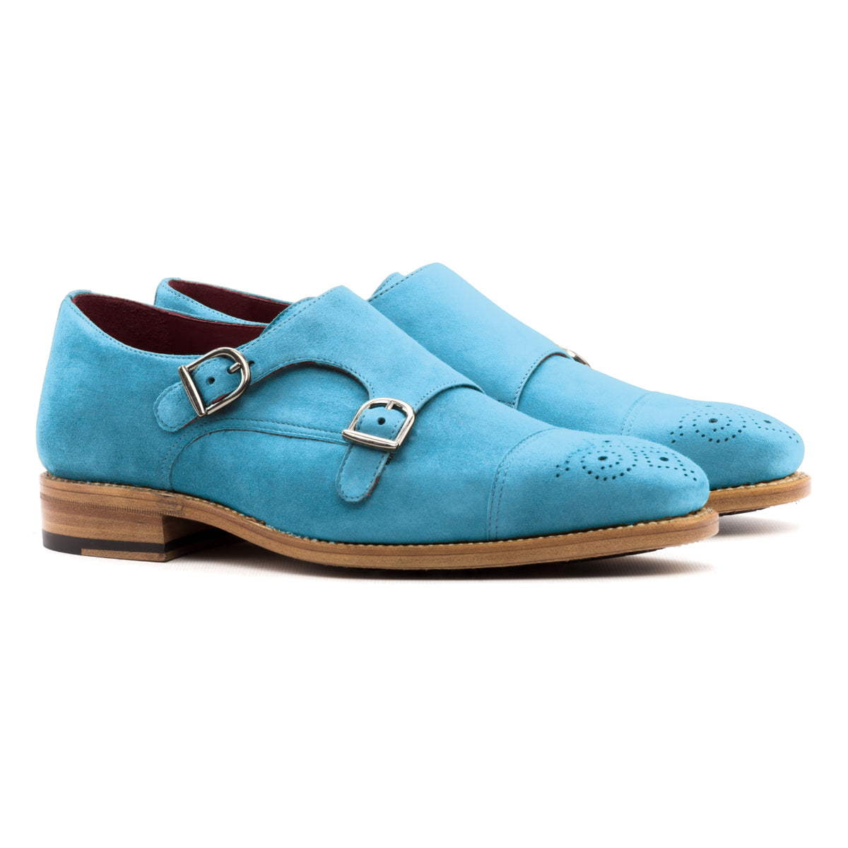 Chaussure double boucle en daim de chevreau turquoise, la paire vue de trois quarts avant