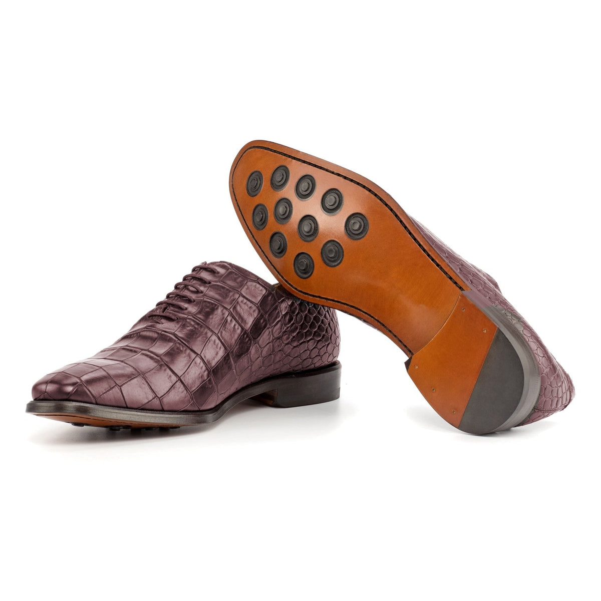 One Cut en cuir façon croco bordeaux : une chaussure debout, l’autre couchée montre sa semelle
